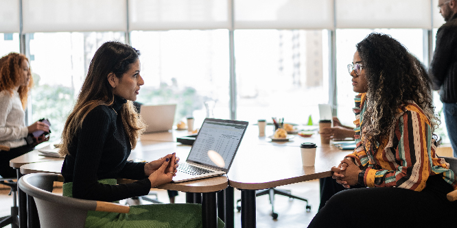 Coworkers talking in the office