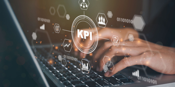 Image of fingers typing on keyboard overlayed with graphic of different icons pertaining to metrics, with one in the center reading KPI