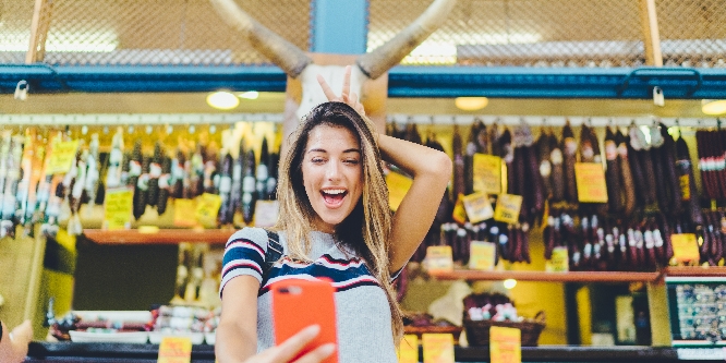 Young woman at the farmer’s market having fun