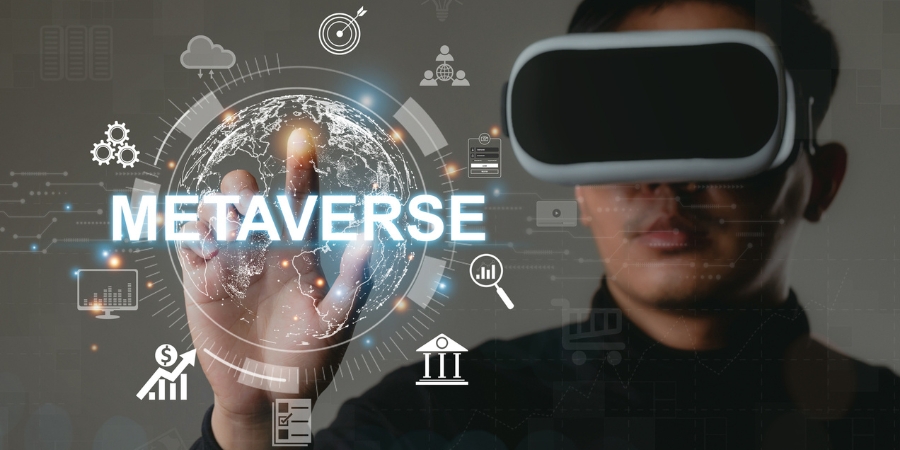 Man in VR headset touching the word "Metaverse"