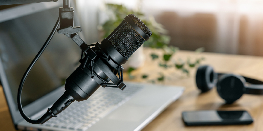 workplace of content creator. home studio for podcasting, online streaming, radio broadcasting. microphone closeup